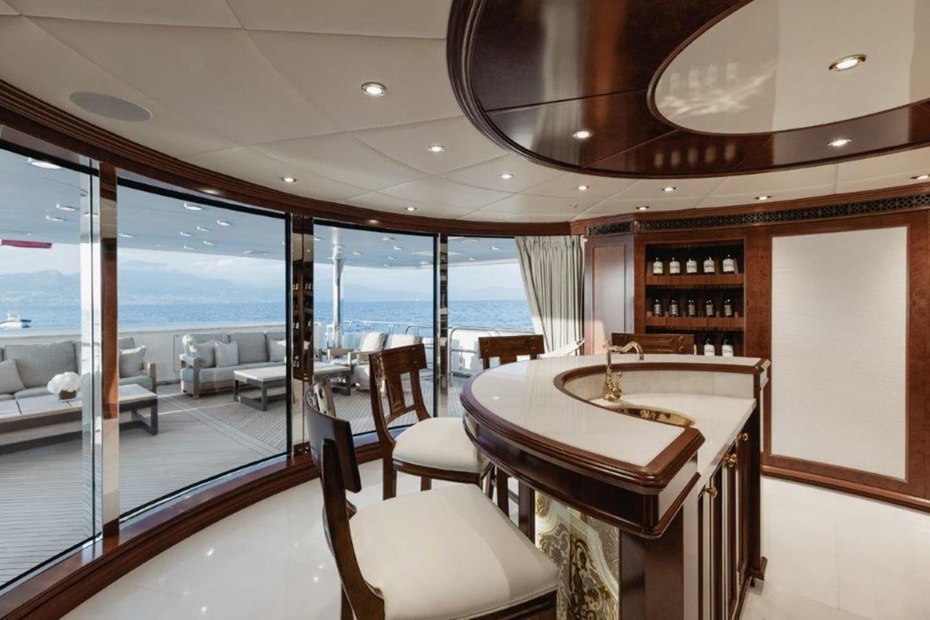a room with a table and chairs aboard IRON BLONDE Yacht for Sale