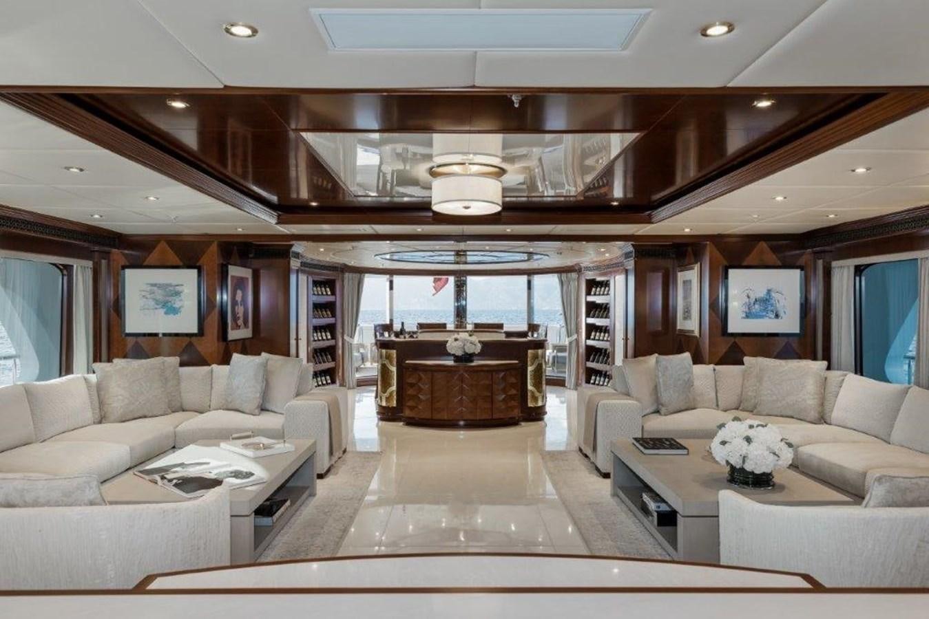 a living room with a fireplace aboard IRON BLONDE Yacht for Sale