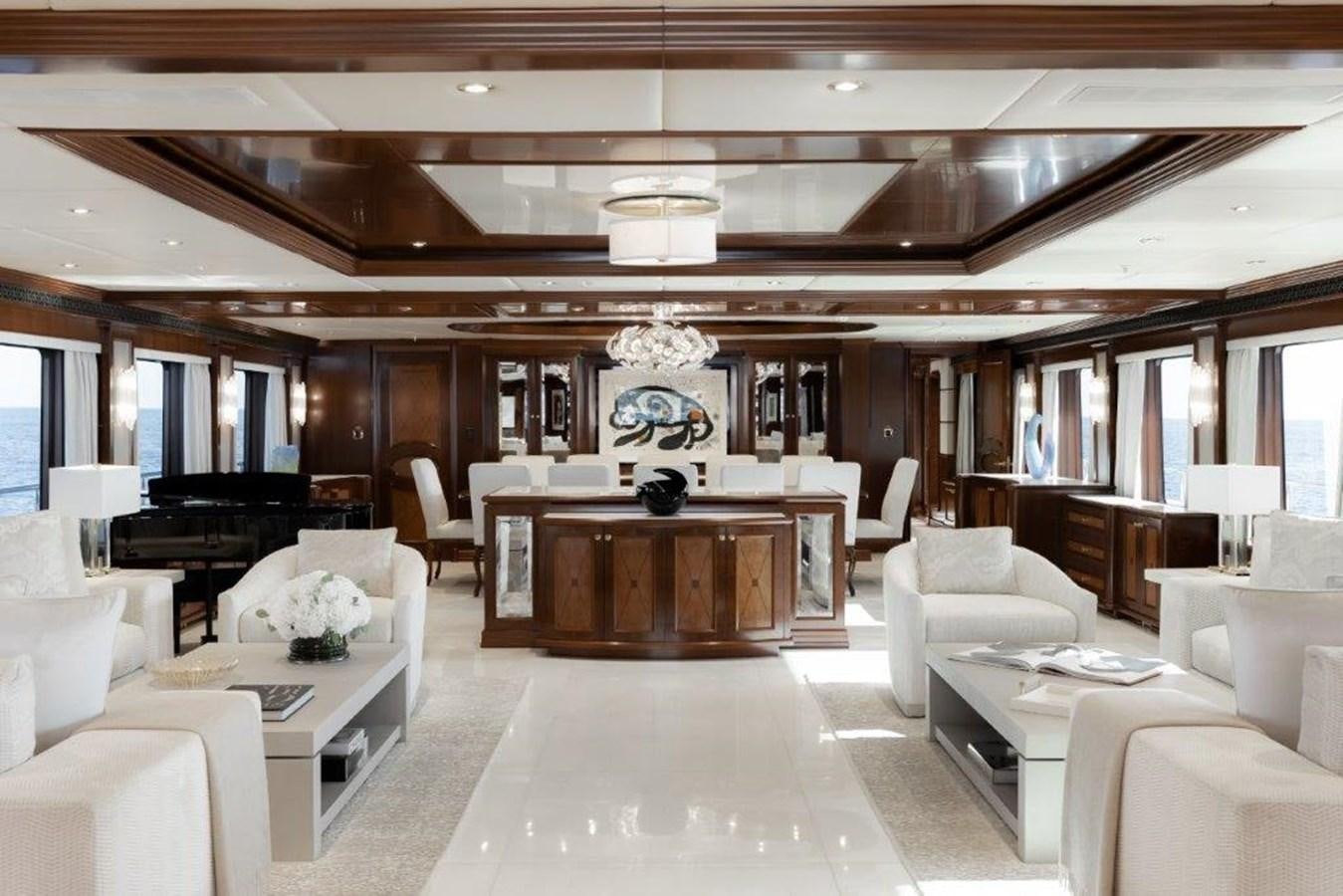 a large room with white furniture aboard IRON BLONDE Yacht for Sale