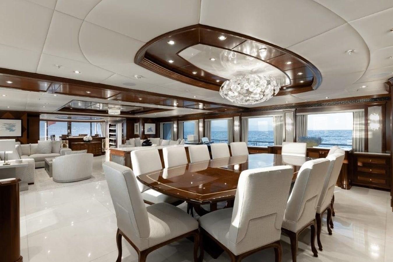 a large room with a chandelier aboard IRON BLONDE Yacht for Sale