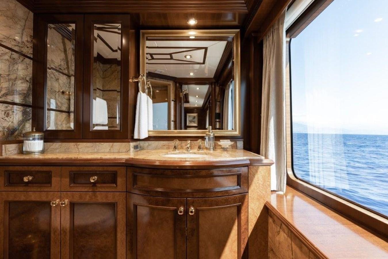 a bathroom with a large mirror aboard IRON BLONDE Yacht for Sale