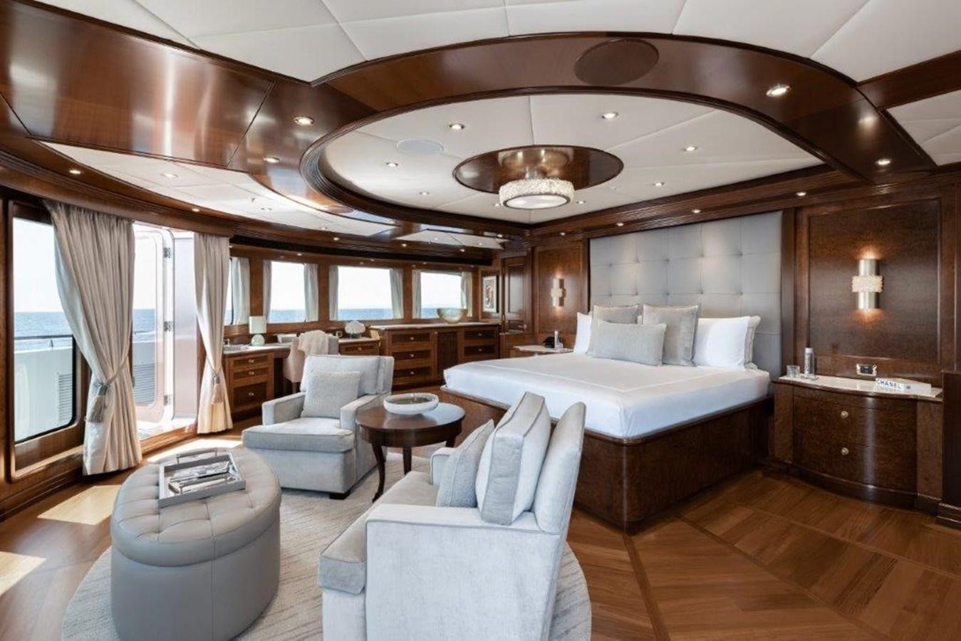 a large bedroom with a large bed aboard IRON BLONDE Yacht for Sale