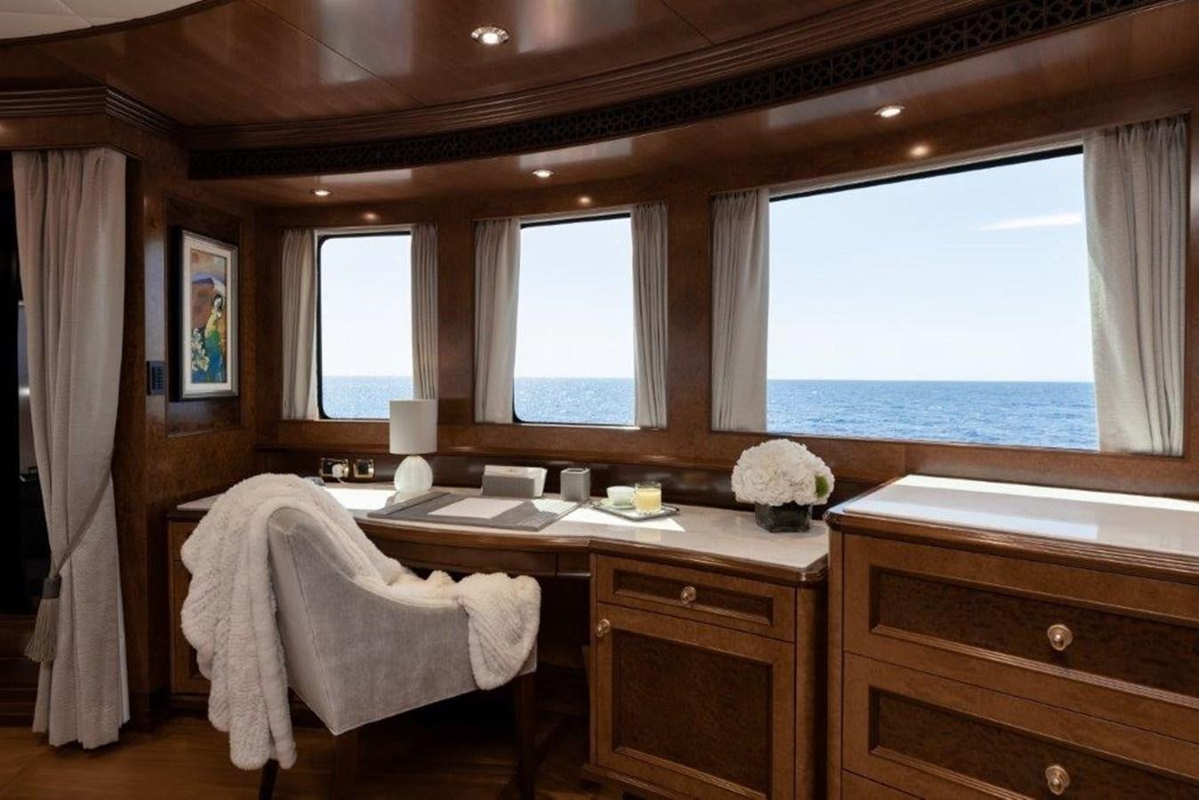 a room with a desk and a window aboard IRON BLONDE Yacht for Sale