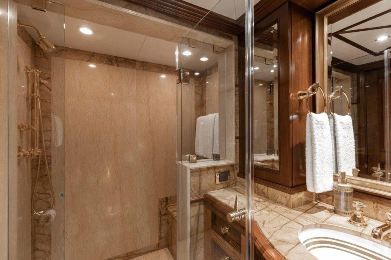 a bathroom with a large mirror aboard IRON BLONDE Yacht for Sale
