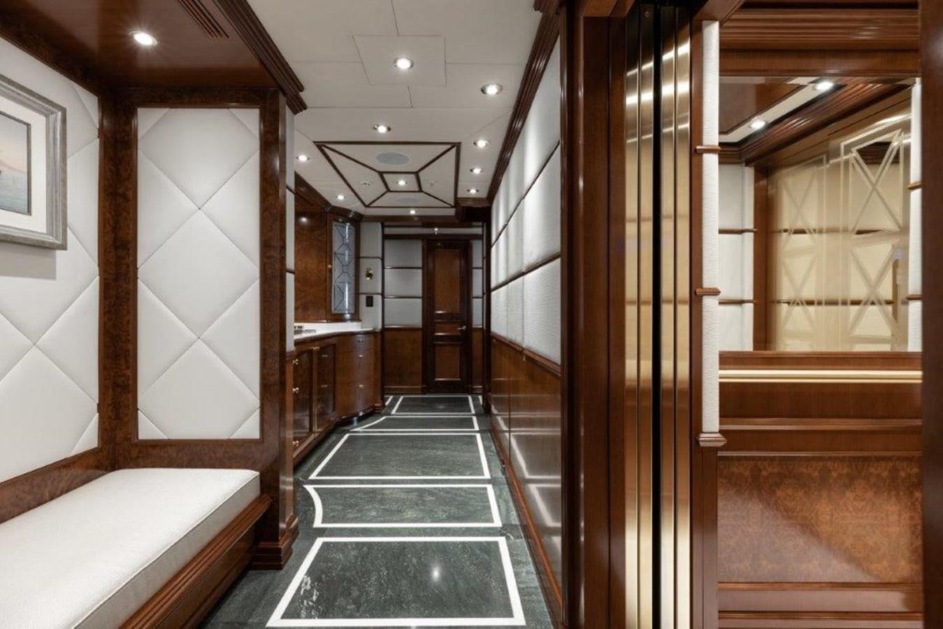 a hallway with several doors aboard IRON BLONDE Yacht for Sale