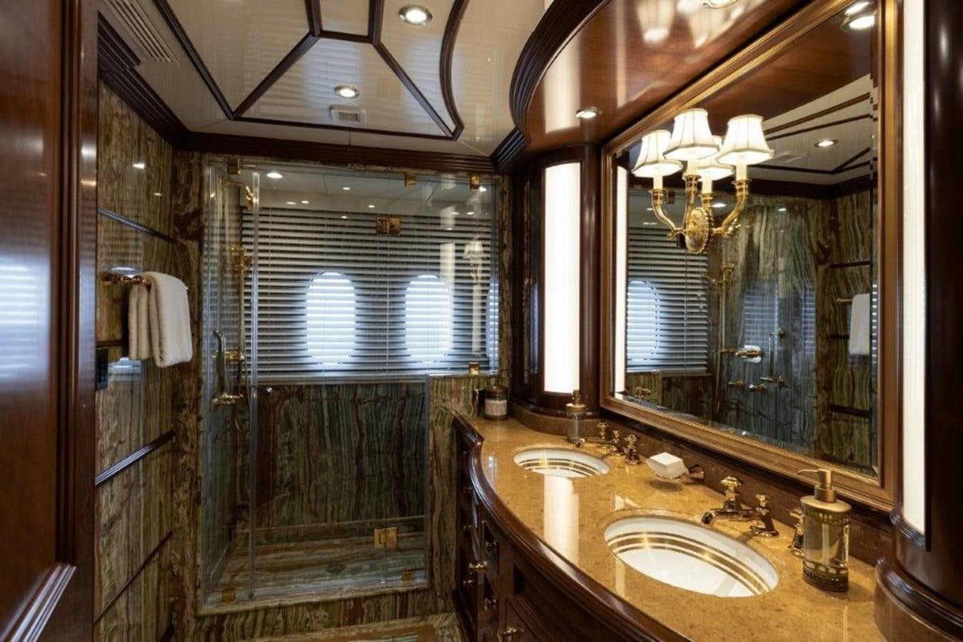 a bathroom with a sink and a mirror aboard IRON BLONDE Yacht for Sale
