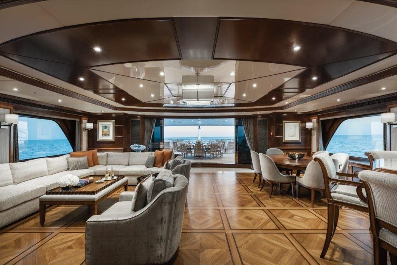 a large living room with a large balcony aboard IRON BLONDE Yacht for Sale