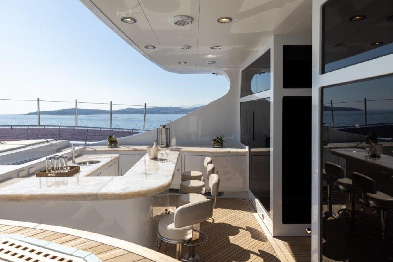a room with a large window overlooking the ocean aboard IRON BLONDE Yacht for Sale