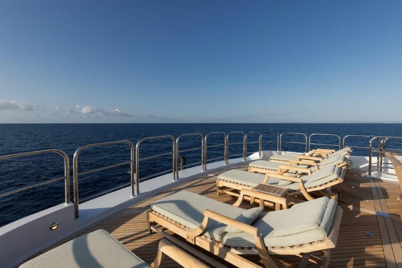 a deck with chairs on it aboard IRON BLONDE Yacht for Sale