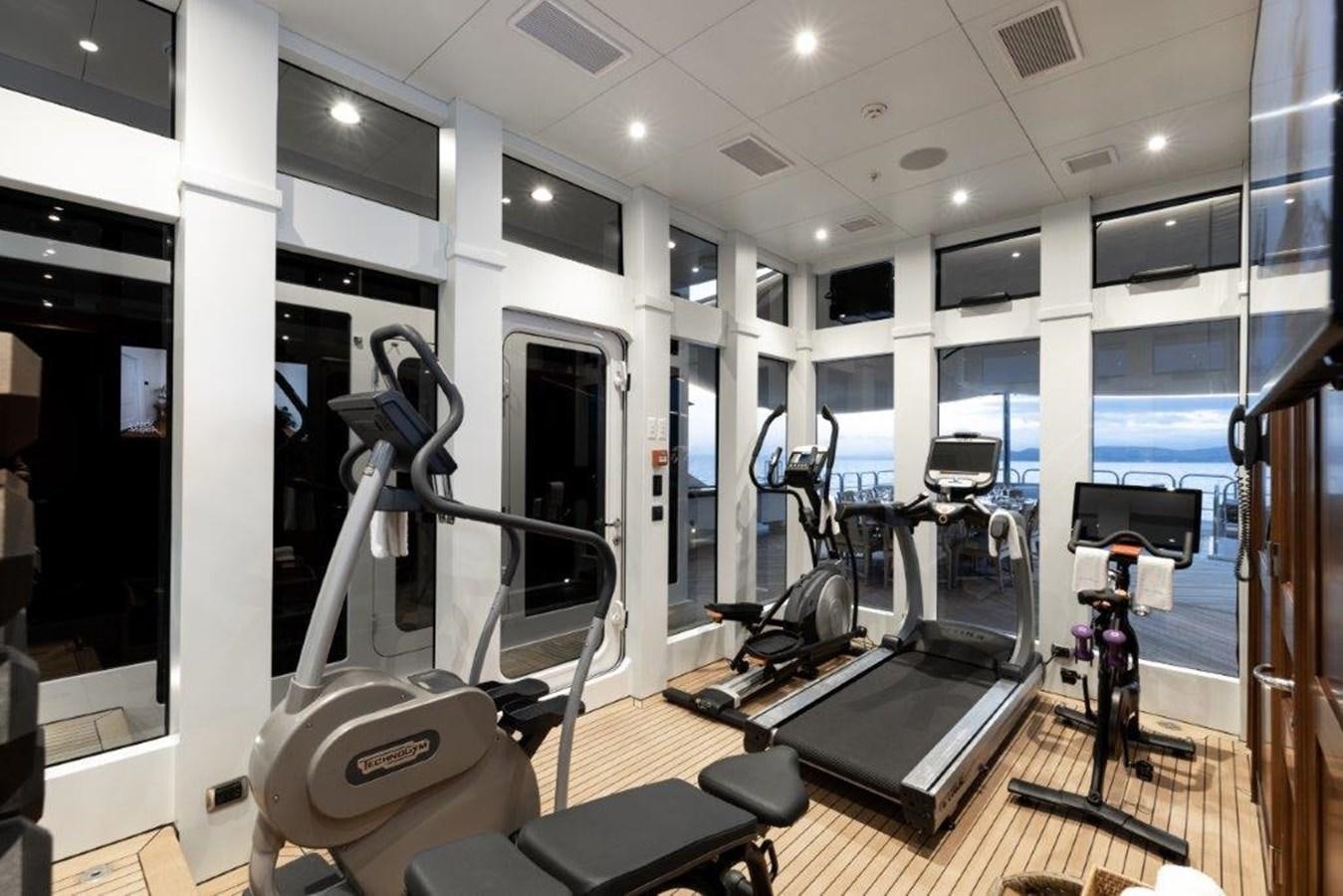 a gym with exercise equipment aboard IRON BLONDE Yacht for Sale