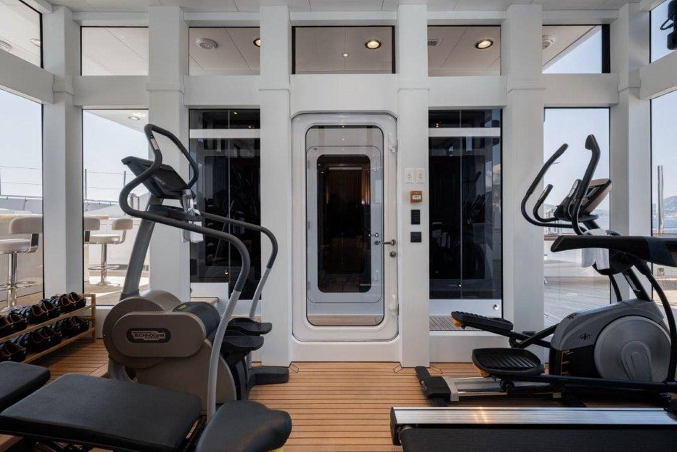 a room with exercise equipment aboard IRON BLONDE Yacht for Sale
