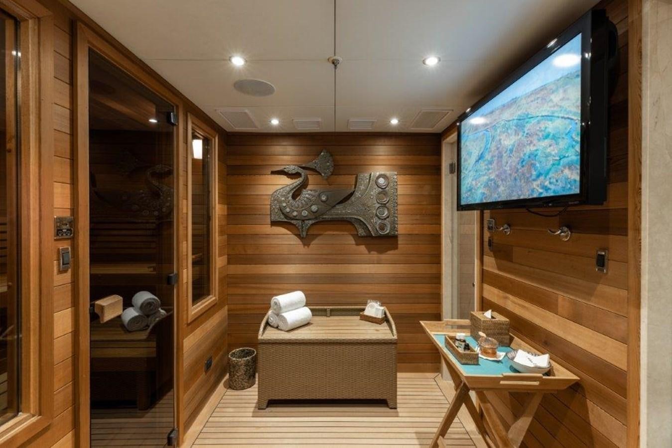 a room with a bed and a desk aboard IRON BLONDE Yacht for Sale