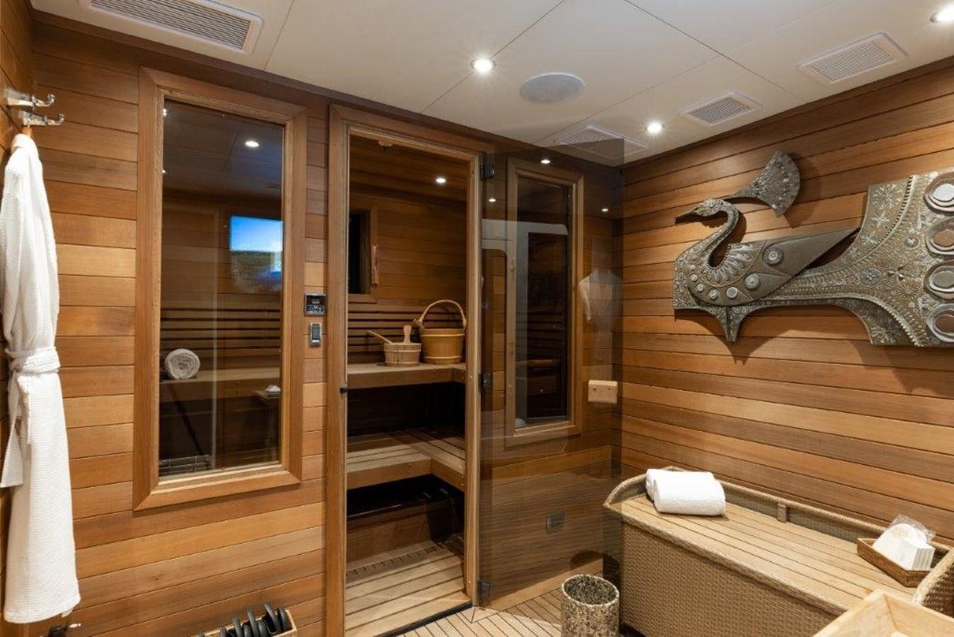 a room with a bed and a mirror aboard IRON BLONDE Yacht for Sale
