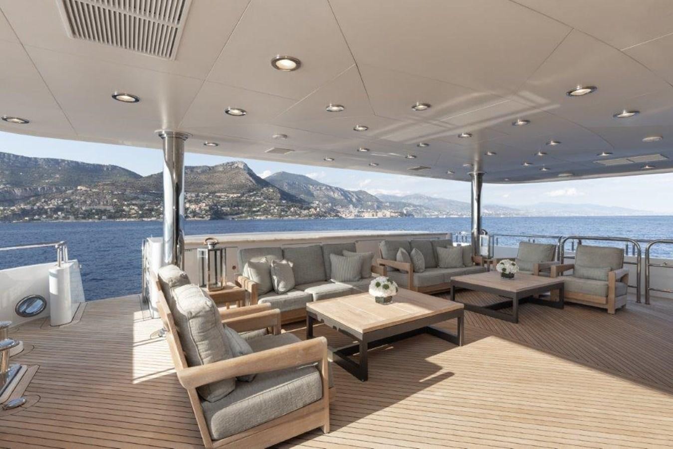 a living room with a large body of water aboard IRON BLONDE Yacht for Sale