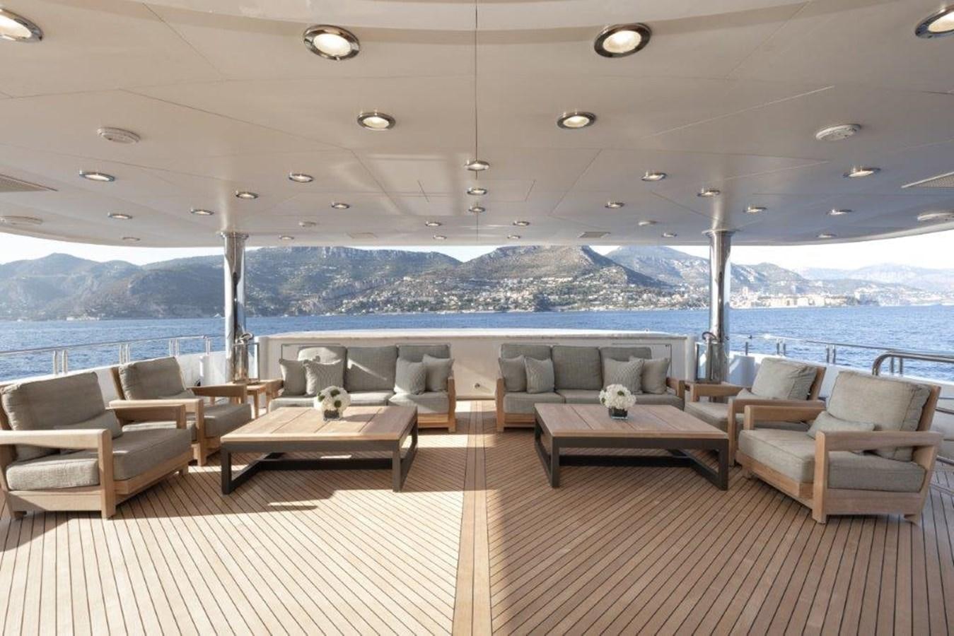 a room with a table and chairs aboard IRON BLONDE Yacht for Sale