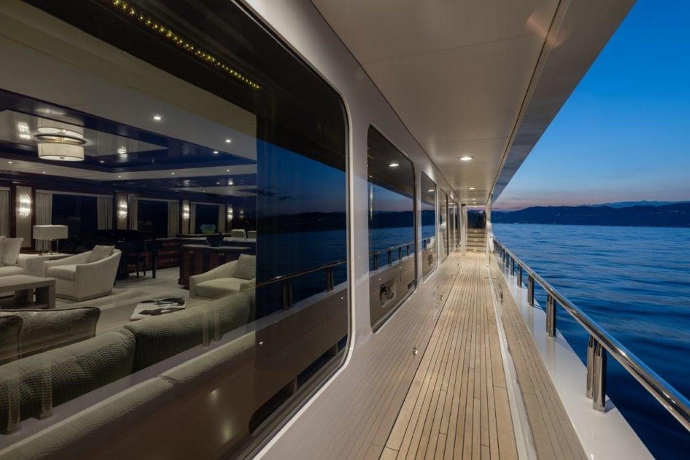 a long wooden dock leading to a large ship aboard IRON BLONDE Yacht for Sale