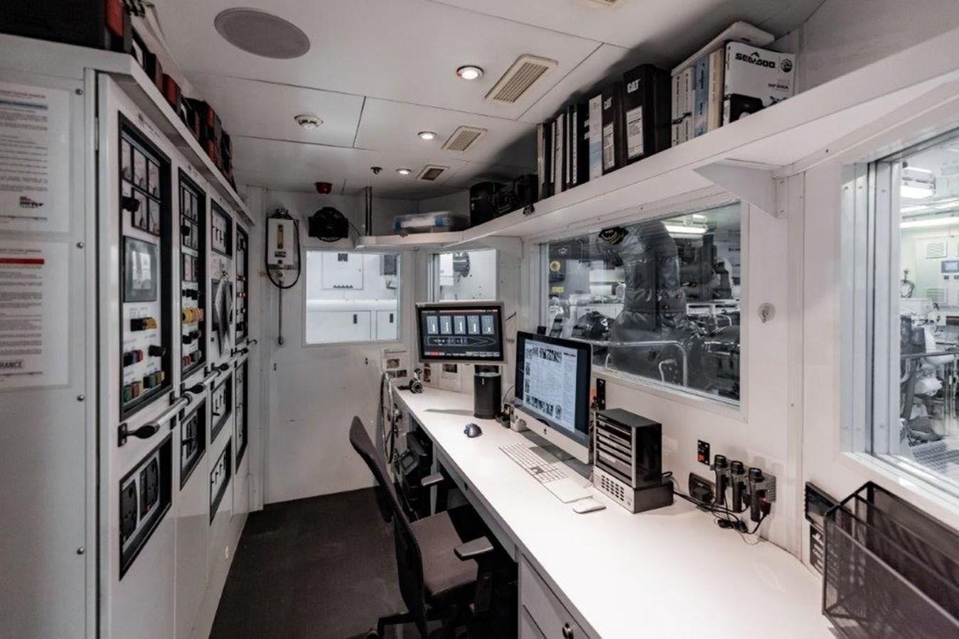 a room with computers and chairs aboard IRON BLONDE Yacht for Sale