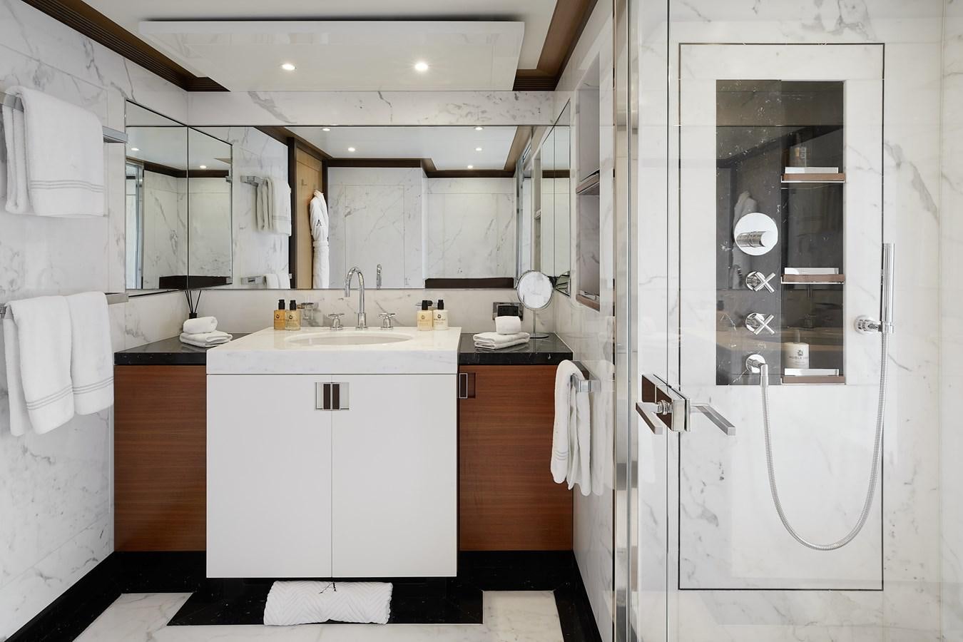 a bathroom with a sink and a mirror aboard LA BLANCA Yacht for Sale