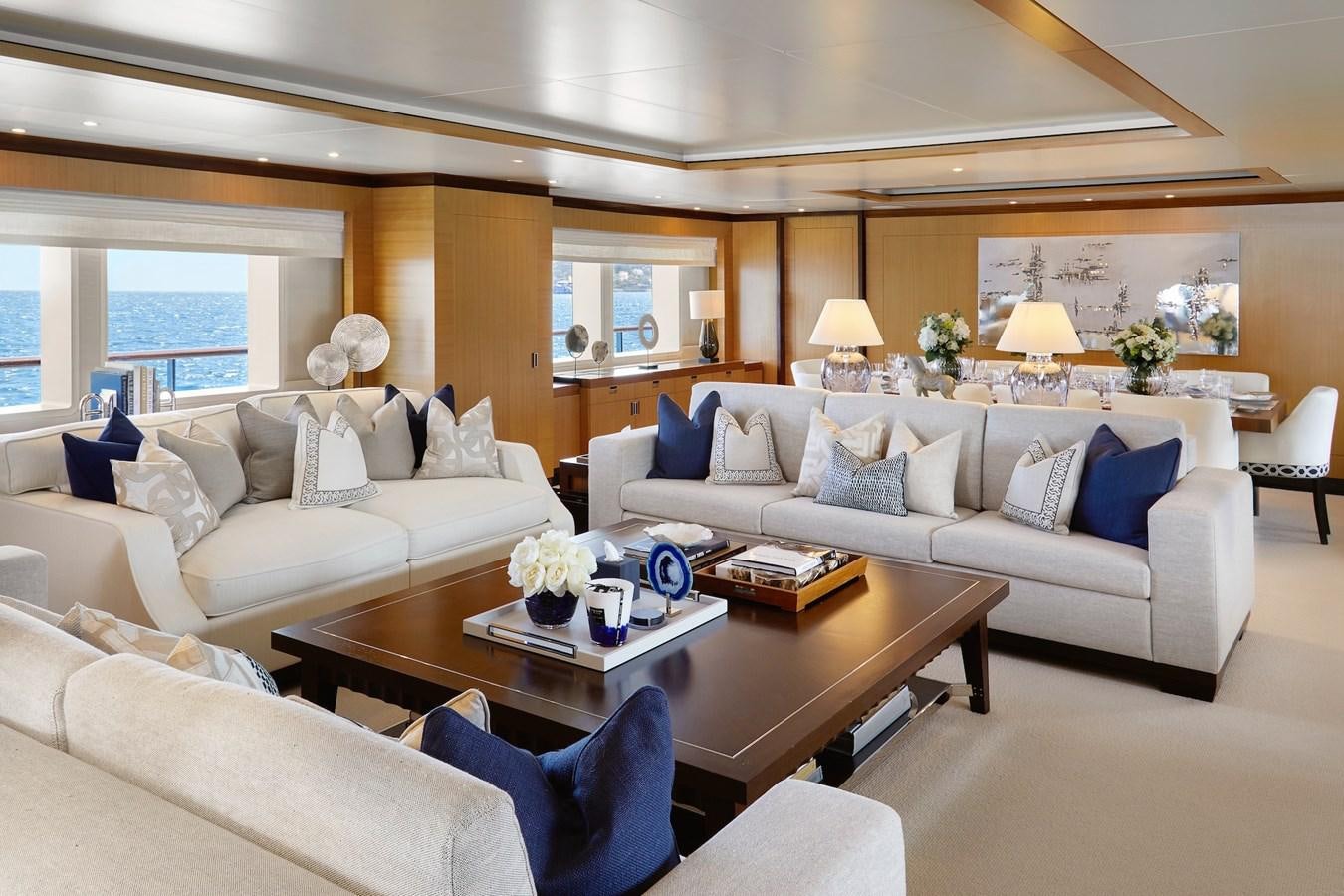 a living room with a couch and a coffee table aboard LA BLANCA Yacht for Sale