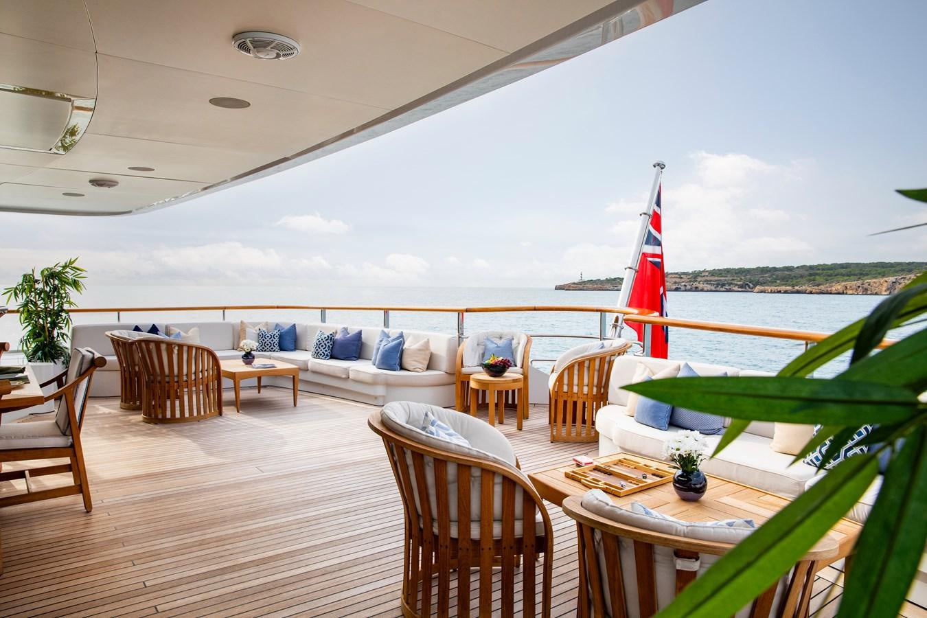 a deck with a large body of water and a beach aboard LA BLANCA Yacht for Sale