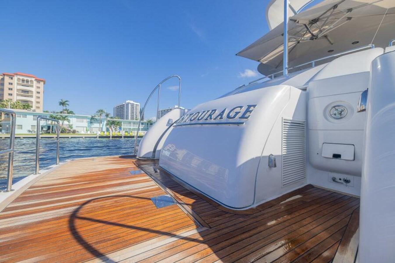 a large white boat on a dock aboard ENTOURAGE Yacht for Sale