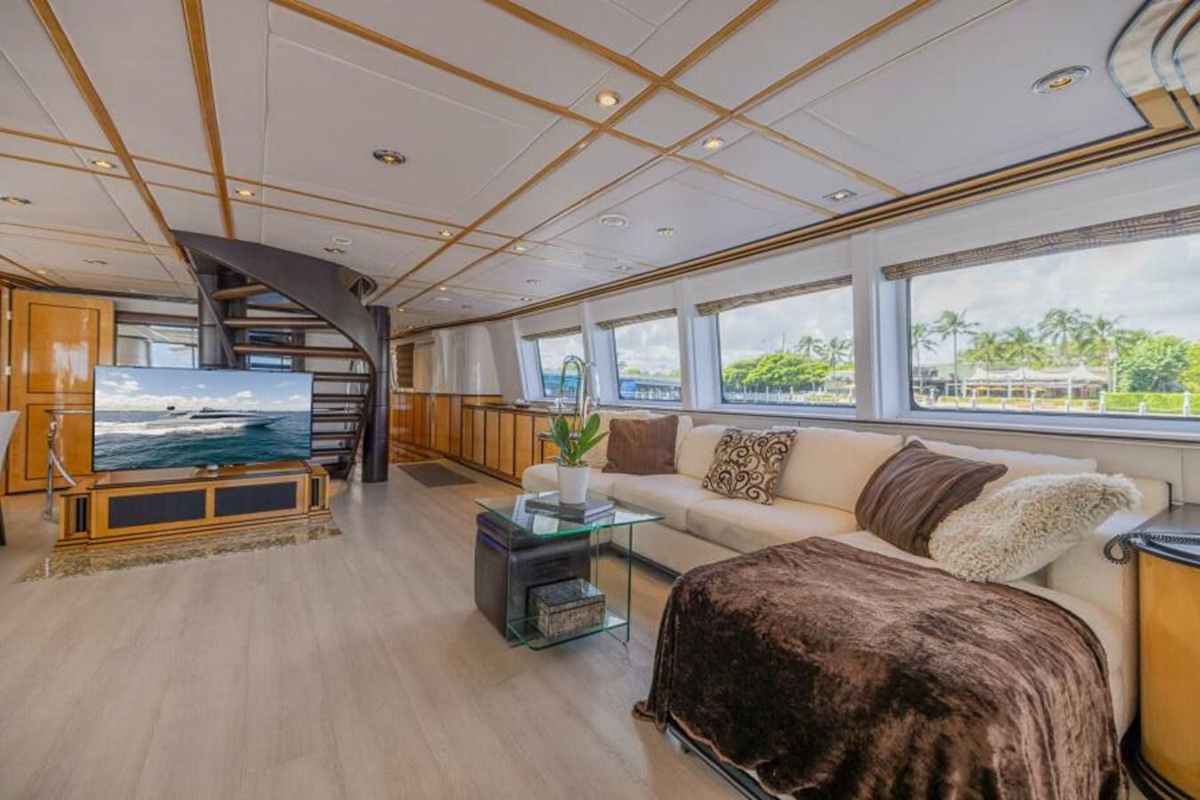 a living room with a large bed aboard ENTOURAGE Yacht for Sale