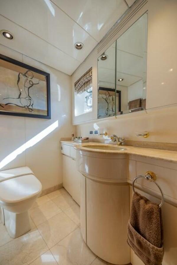 a bathroom with a sink and a toilet aboard ENTOURAGE Yacht for Sale