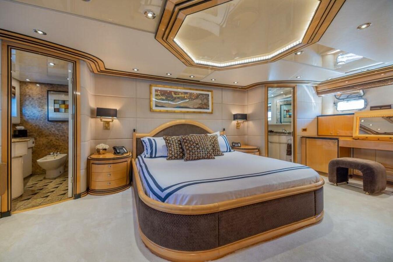 a large bedroom with a bed aboard ENTOURAGE Yacht for Sale