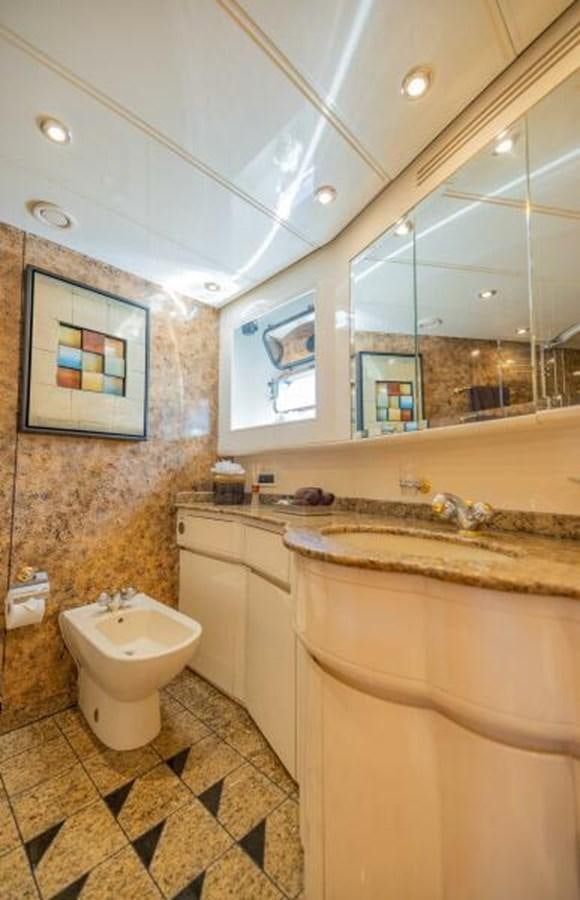 a bathroom with a sink and a toilet aboard ENTOURAGE Yacht for Sale