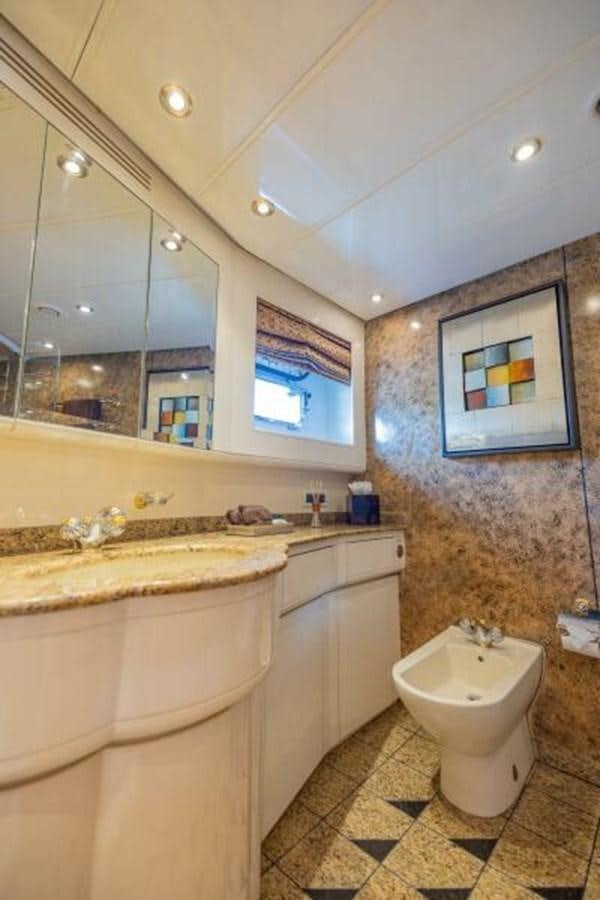 a bathroom with a sink and a mirror aboard ENTOURAGE Yacht for Sale