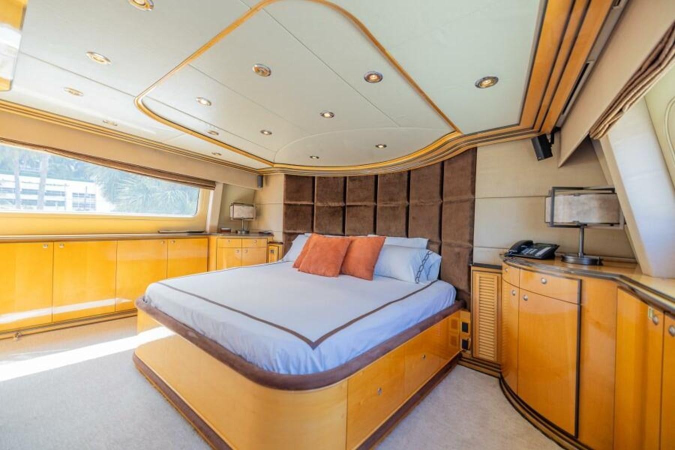 a large bedroom with a large bed aboard ENTOURAGE Yacht for Sale