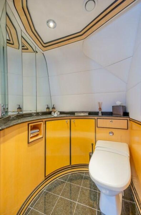 a bathroom with a toilet and a sink aboard ENTOURAGE Yacht for Sale