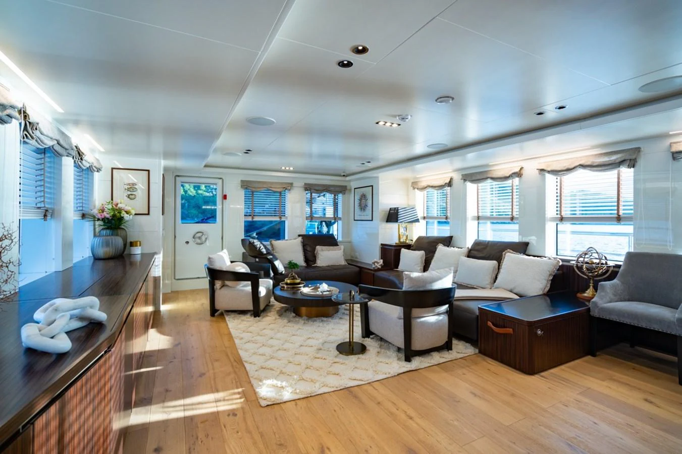 a living room with a wood floor aboard K584 Yacht for Sale