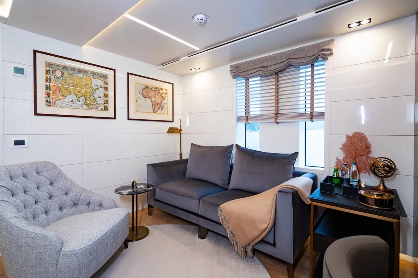 a living room with a couch and a table aboard K584 Yacht for Sale
