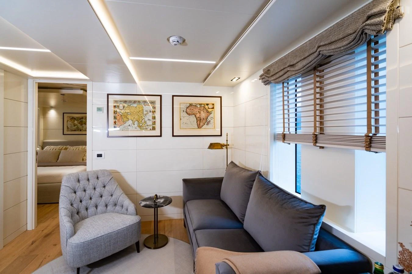 a living room with a couch and a window aboard K584 Yacht for Sale