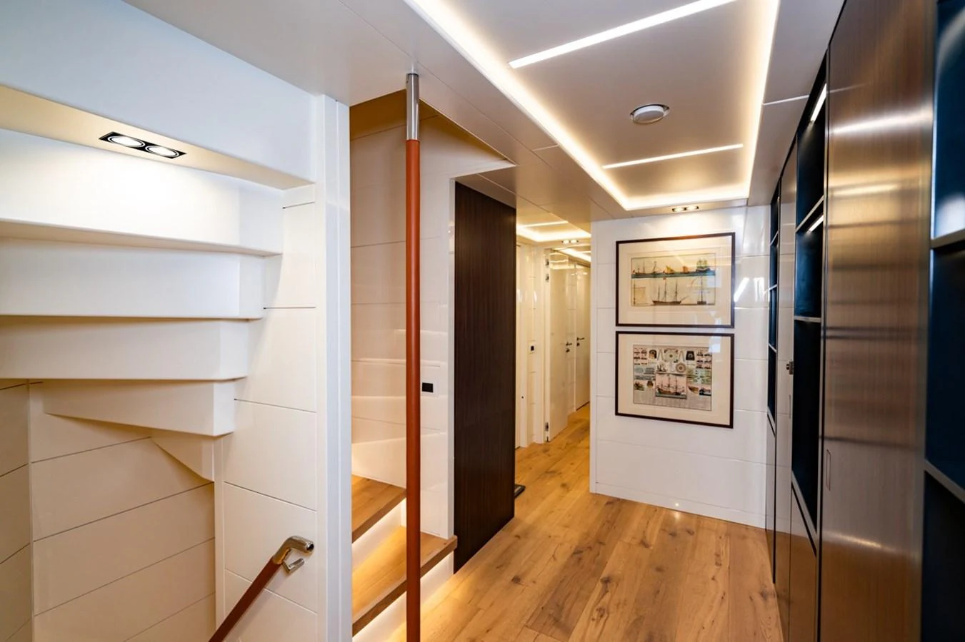 a room with white cabinets and wood floors aboard K584 Yacht for Sale