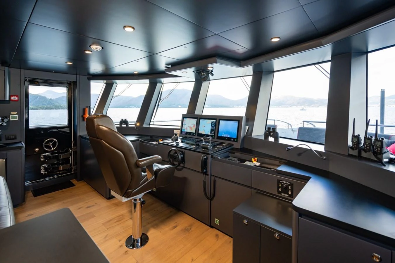a room with a desk and chairs aboard K584 Yacht for Sale