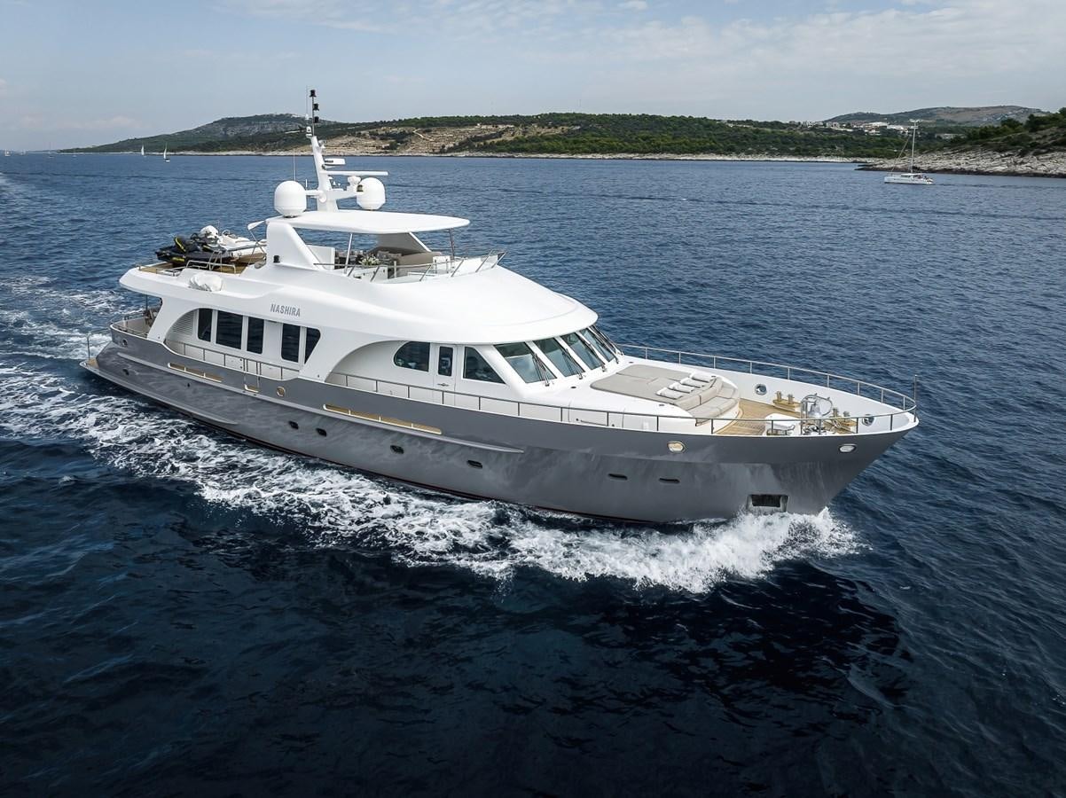 a large white boat on the water aboard NASHIRA Yacht for Sale