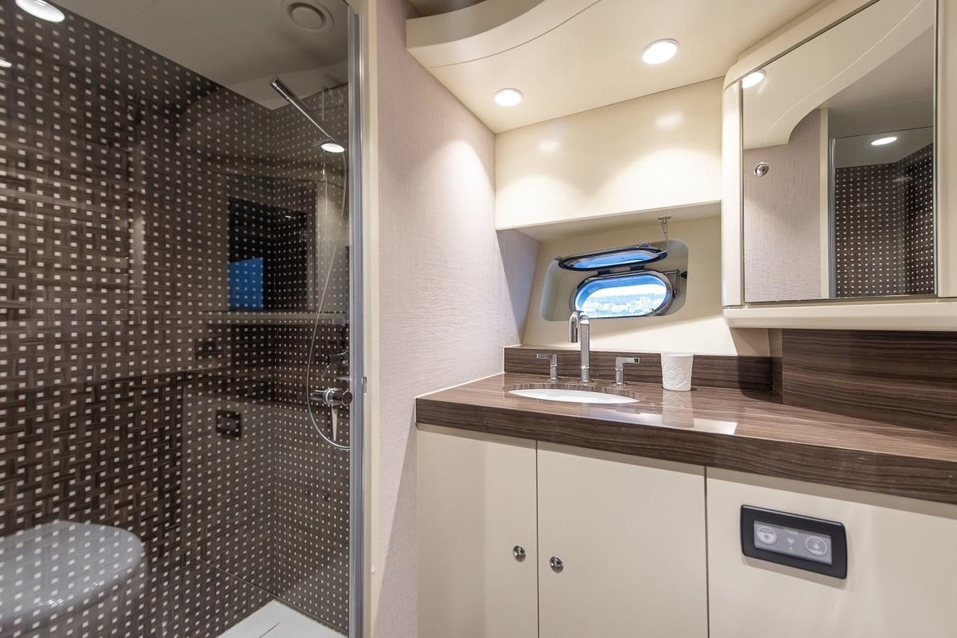 a bathroom with a sink and a mirror aboard NASHIRA Yacht for Sale