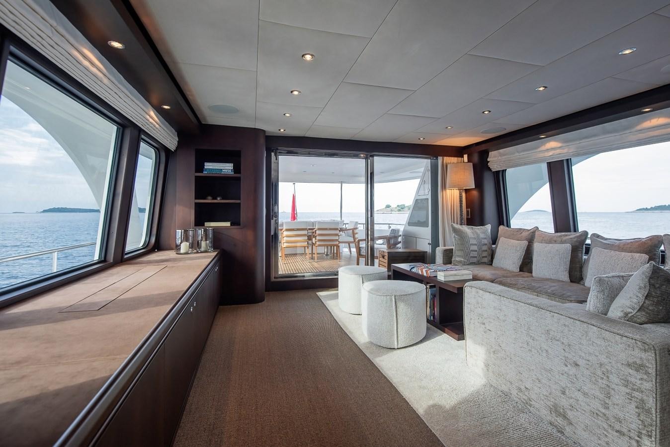 a living room with a large window aboard NASHIRA Yacht for Sale