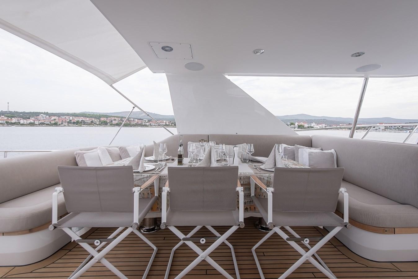 a white lounge chair on a boat aboard NASHIRA Yacht for Sale