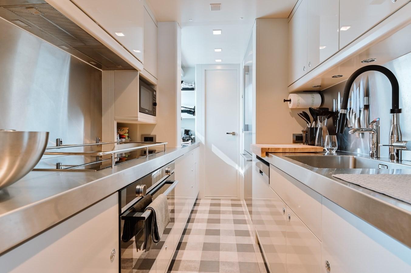 a kitchen with stainless steel sinks aboard NASHIRA Yacht for Sale