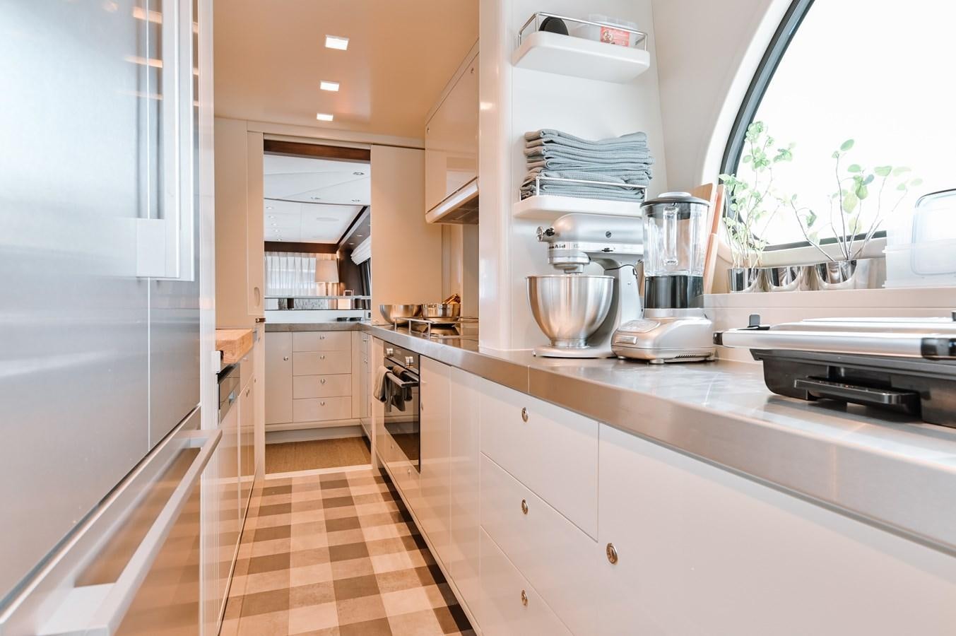 a kitchen with a stainless steel mixer aboard NASHIRA Yacht for Sale