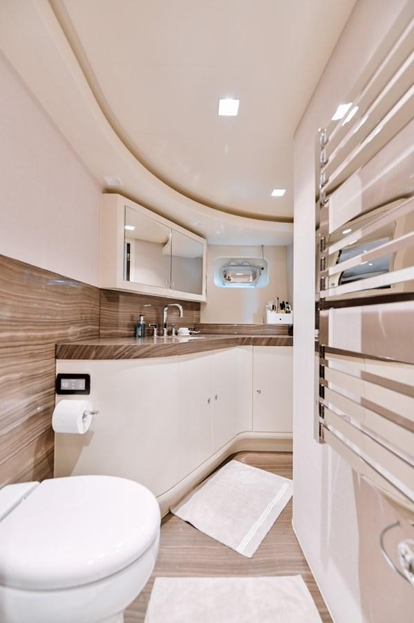 a bathroom with a sink and a toilet aboard NASHIRA Yacht for Sale