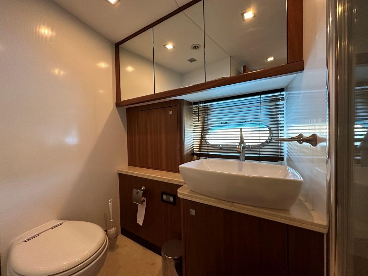 a bathroom with a sink and a toilet aboard LOW PROFILE Yacht for Sale