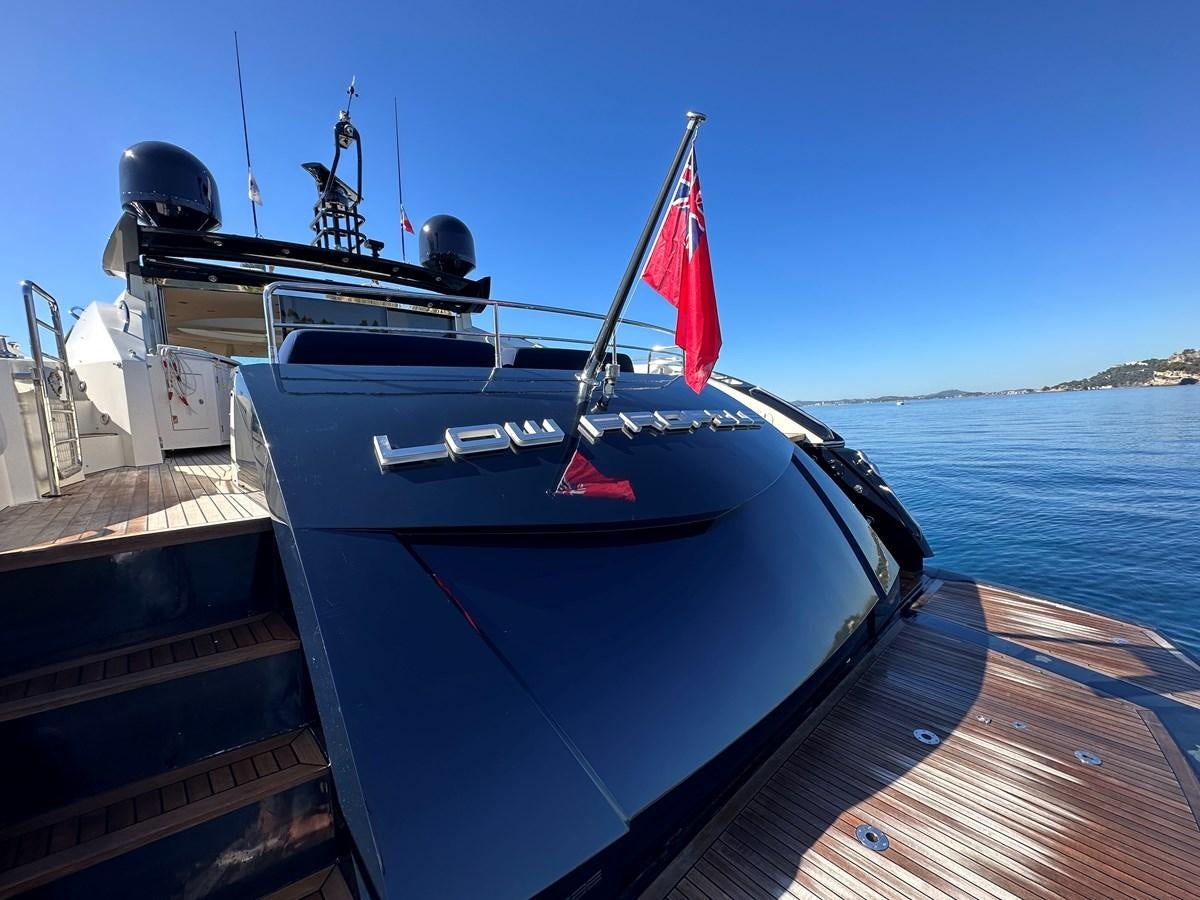 a boat on a dock aboard LOW PROFILE Yacht for Sale