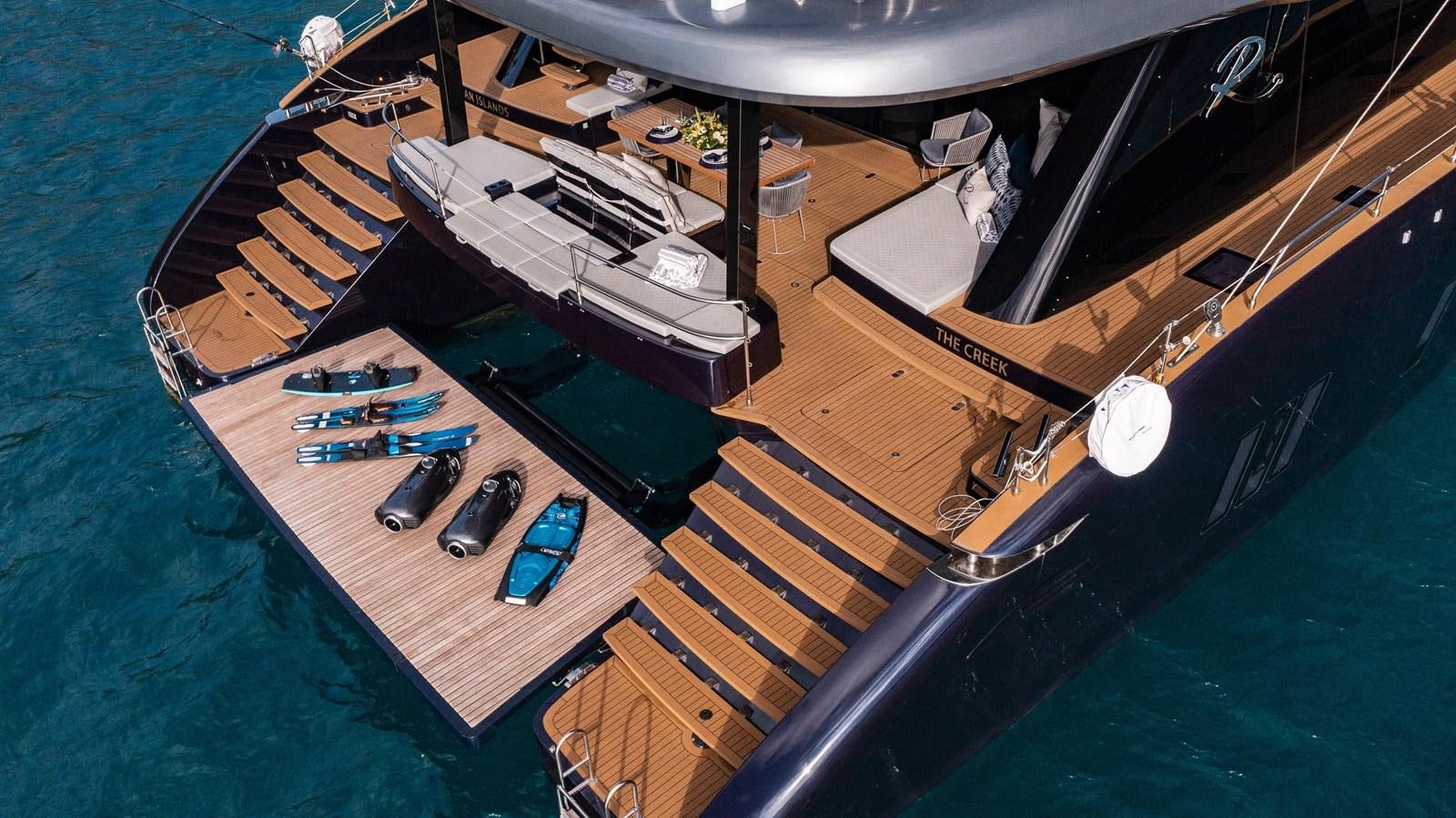 a model of a boat on a body of water aboard 2022 SUNREEF 80 SAILING Yacht for Sale