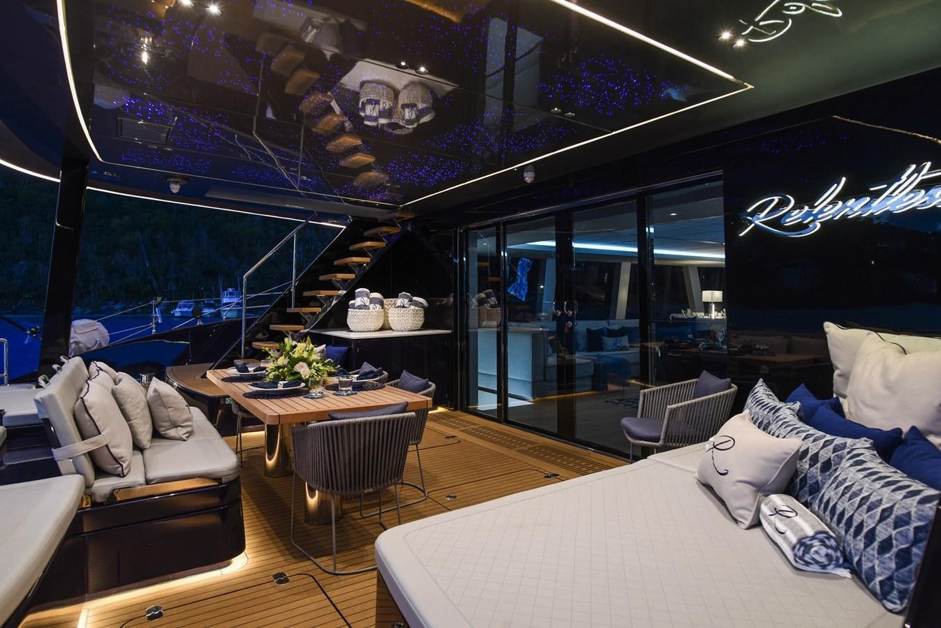 a room with a couch and a table and chairs aboard 2022 SUNREEF 80 SAILING Yacht for Sale