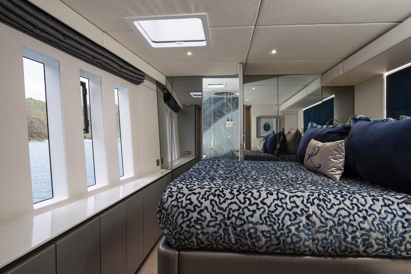 a bed in a room aboard 2022 SUNREEF 80 SAILING Yacht for Sale