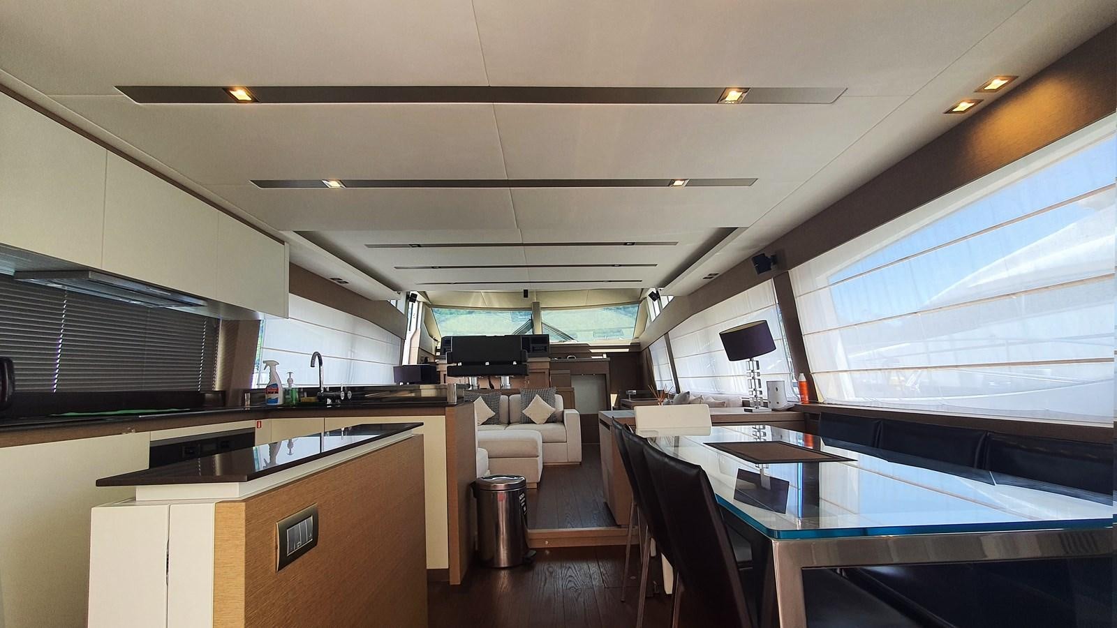 a room with a table and chairs aboard NEW FISH Yacht for Sale